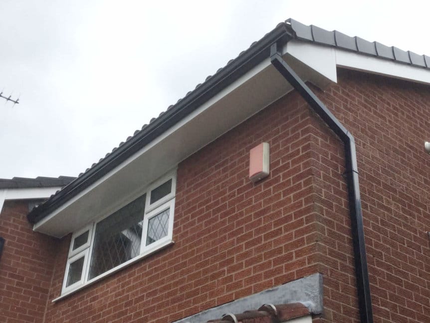 Black Seamless Guttering, White Fascias and Soffits inc Dry verges - Gutter Art